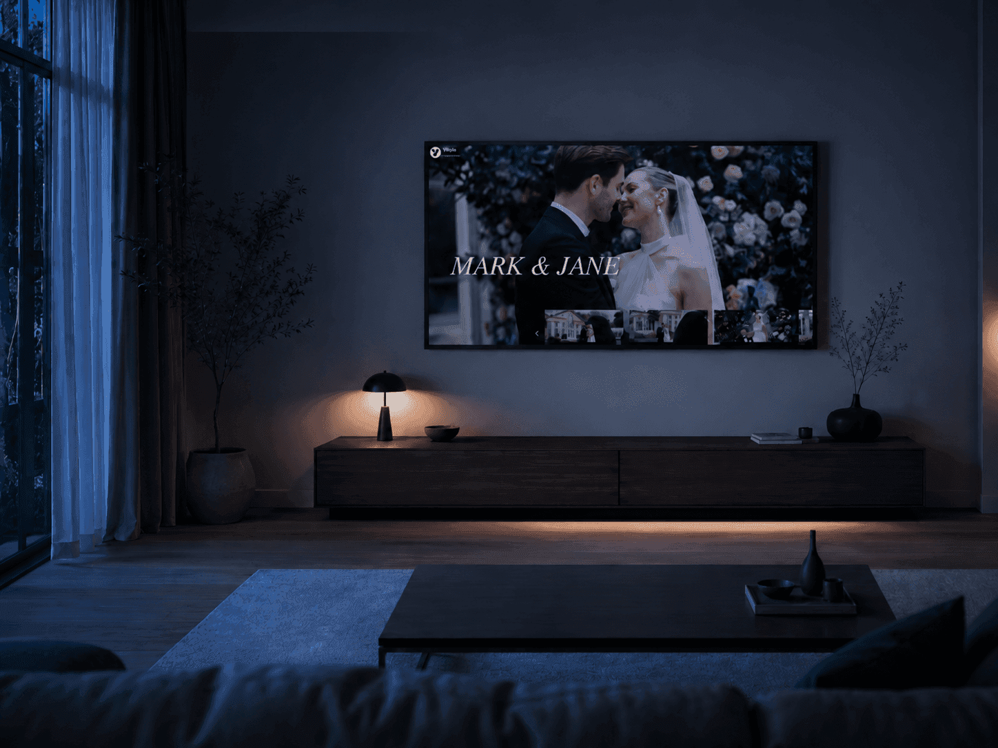 Vyredo wedding film gallery playing on a TV in a modern living room
