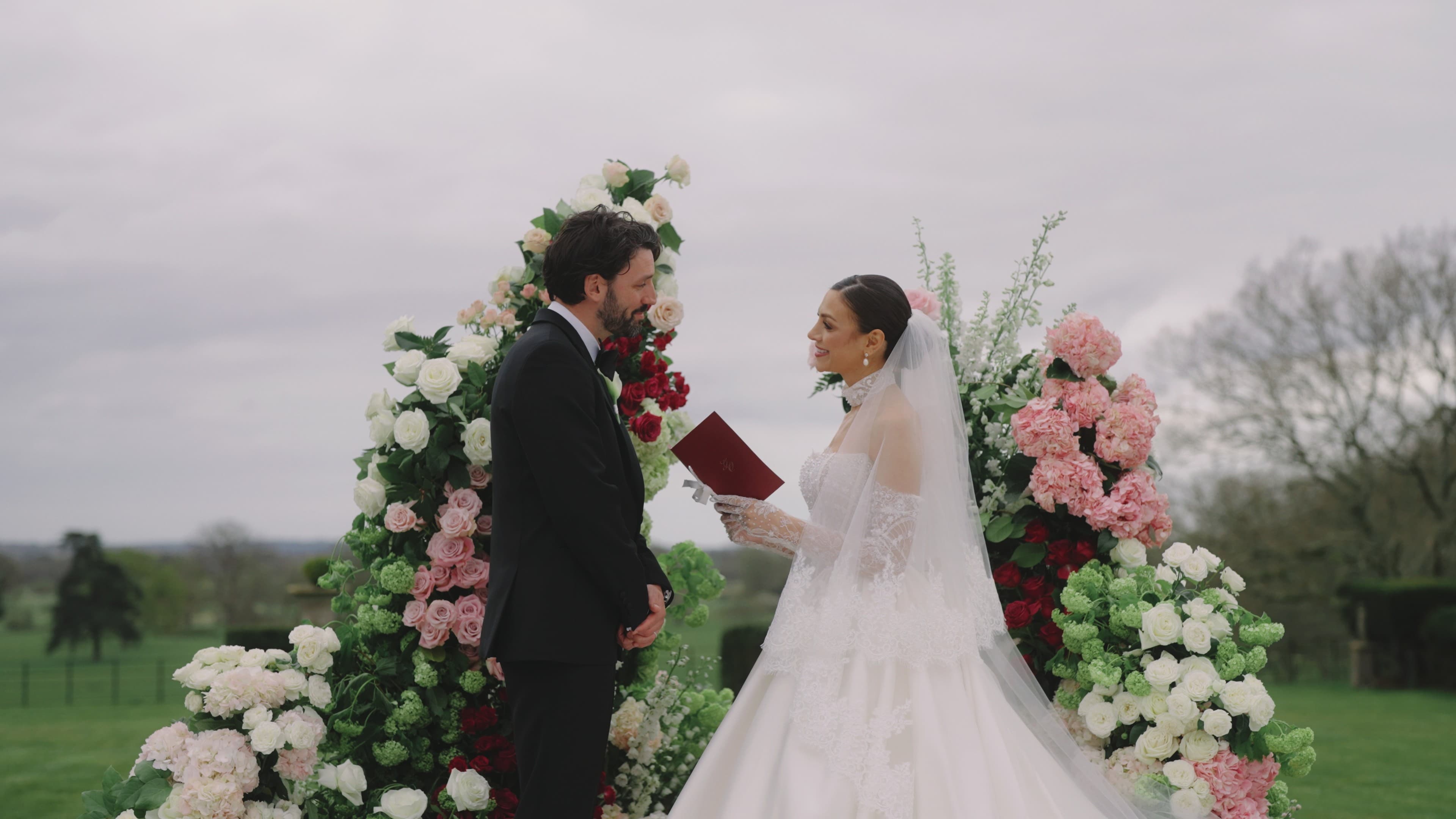 Outdoor wedding ceremony with floral arch